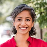 Smiling woman wearing a bright red shirt